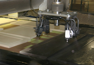 Image showing a clean line stain sprayer finishing doors on a conveyor belt