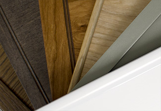 Image showing a close-up of fanned out slim shaker doors with in various species and finishes