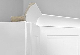 Image of white upper cabinet with RTF crown and nailing strip molding