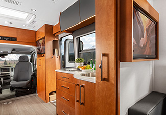 RV interior showing wood cabinetry